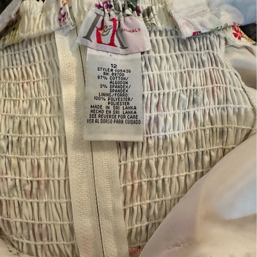 Size 12. Only worn a few times. Beautiful dress